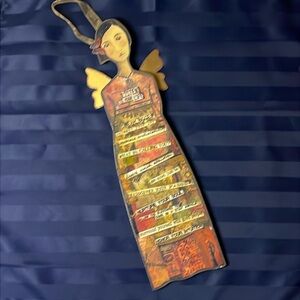 Kelly Rae Robert’s angel wall hanging